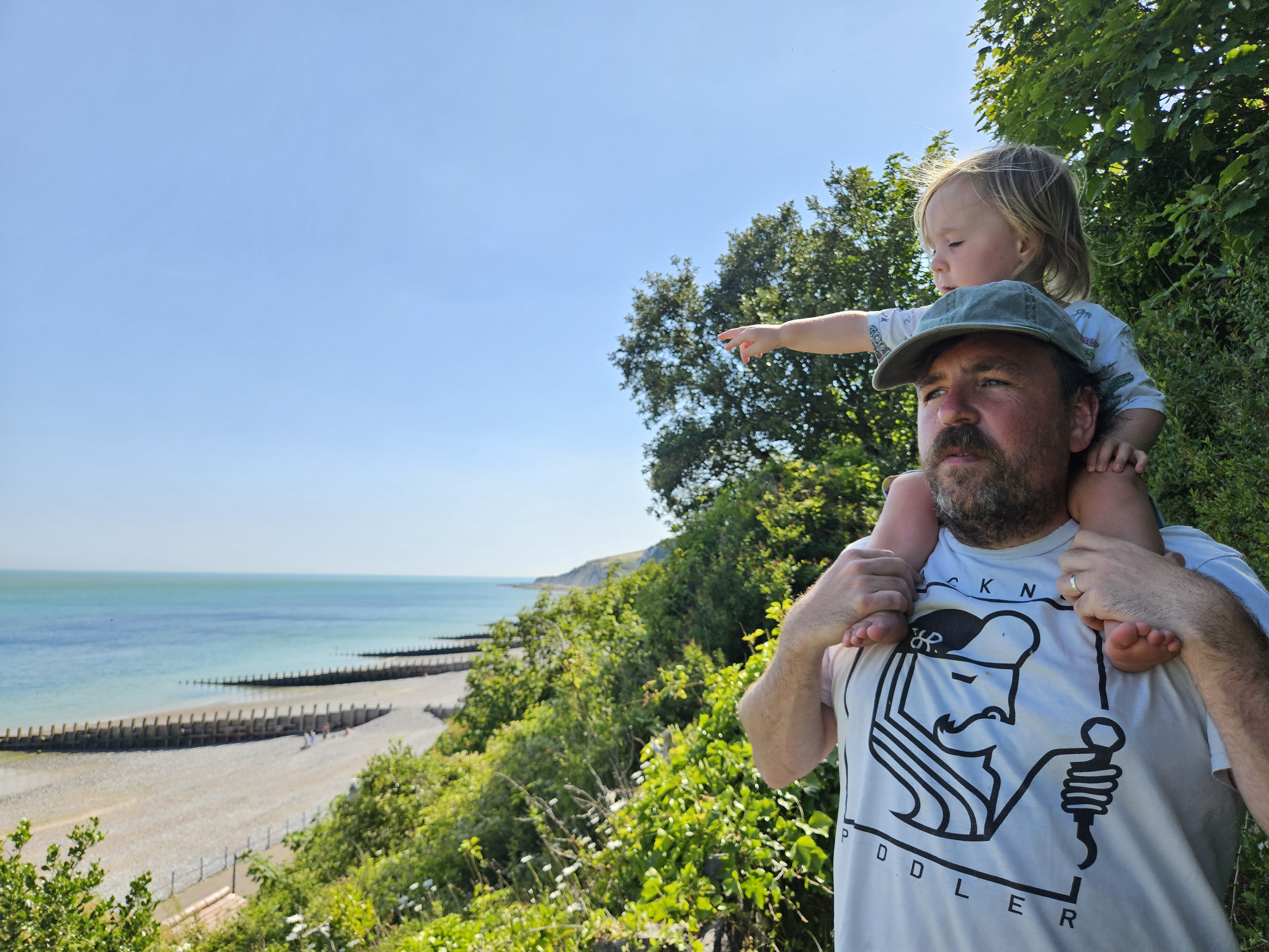 Rob at the beach with child